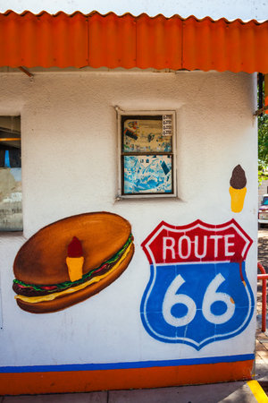 ROUTE 66, ARIZONA, USA - OCTOBER 8, 2009: "America's Main Street". Wall of the house with graffiti. Historic Highway 66 is a scenic popular road in the United States.のeditorial素材