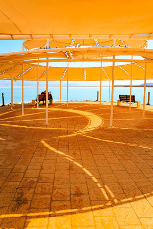 The drainless salt lake in the Middle East. Picturesque gallery on the seashore. Coast of Israel. The Dead Sea. Famous resort in Israelの写真素材