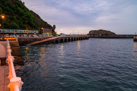 Embankment of the resort town of Cudillero. Asturias. Spain. Evening twilight on the Atlanticの写真素材