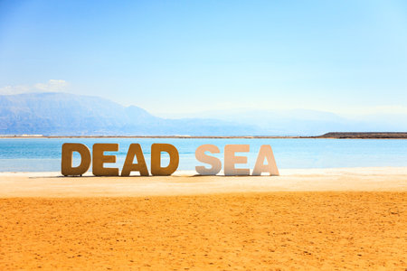 Memorial sign with the name of Dead Sea. The drainless salt lake in the Middle East. Coast of Israel.の写真素材