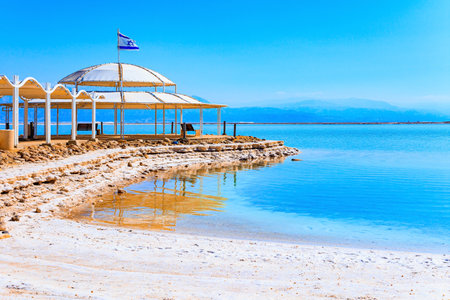 Dead Sea - the saltiest lake in the world. Coast of Israel. The drainless salt lake in the Middle East. Long covered gallery on the beach.の写真素材