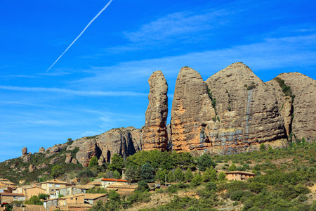 Aguero village at the foot of the dangerous and magnificent Mallos cliffs. Romantic trip to northern Spain. The magical nature of Spain. Province of Huesca, Aragon.の写真素材