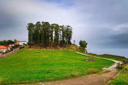 Candas. Atlantic coast, Asturias, Spain. Part of the famous Costa Verde beach. Grove in the city's...