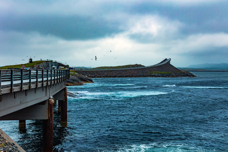 Atlantic Road: the most beautiful road in the world. Norway. Cold and stormy July day. Scenic bridge over the ocean. Rain over the famous bridge in the icy sea.の写真素材