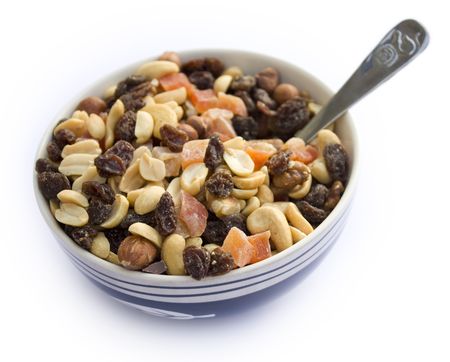 Breakfast bowl filled with healthy fruits and nuts. On white background.の写真素材