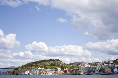 A nice summer day in the west Norwegian city Kristiansund, which is located on five islands connected by bridges and Sundbåten, one of the oldest motored ferry services still running. の写真素材