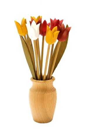 Wooden flowers in a vase, isolated on white backgroundの写真素材