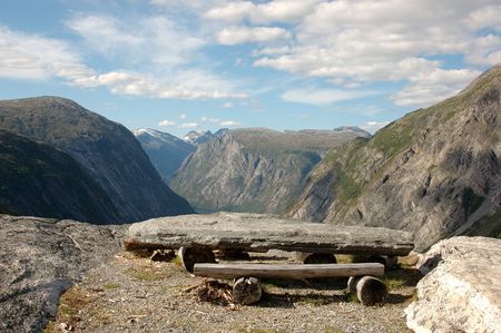 Picnic table on top of a mountain, overlooking a Norwegian glacial valley; Finsetlia, Eikesdalenの写真素材