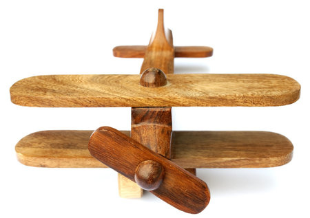 Old wooden toy airplane isolated on white backgroundの写真素材