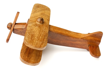 Old wooden toy airplane isolated on white backgroundの写真素材