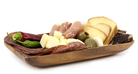 Wooden plate with assorted meat and cheeseの写真素材