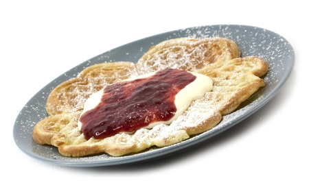 Traditional Norwegian waffles served with sourcream, jam and sugarの写真素材