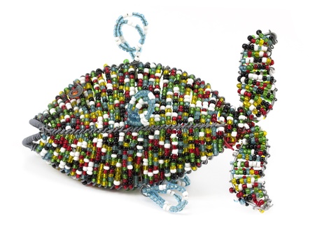Colorful beaded fish isolated on white backgroundの写真素材
