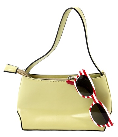 Purse with striped sunglasses on white backgroundの写真素材