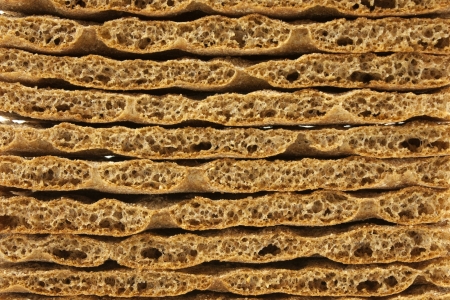 Uniform background of healthy swedish wholemeal crispbreadの写真素材