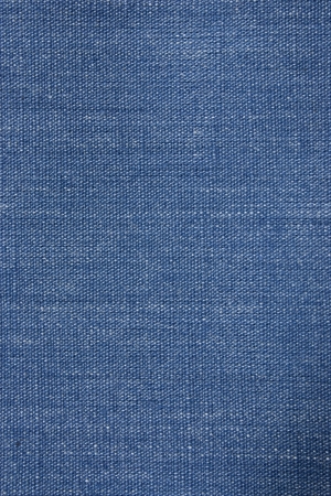 Blue denim background closeup with visible weaveの写真素材