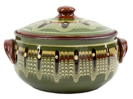 Traditional decorated glazed green clay pot on whiteの写真素材