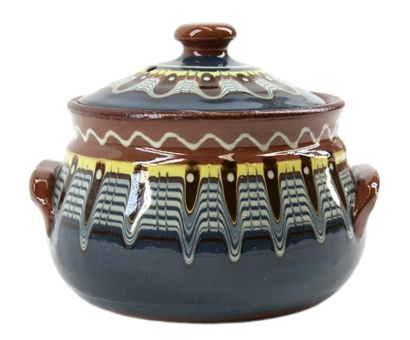 Old traditional bulgarian decorated clay pot isolated on whiteの写真素材