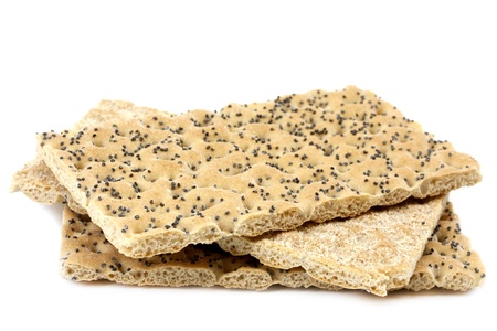 Crisp bread with poppy seeds on white の写真素材