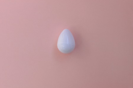 Plastic toys eggs on pink background close upの写真素材