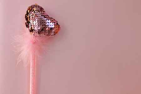 Fairy magic wand on a pink pastel background.の写真素材