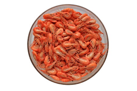 Top view of shrimps on a plate isolated on white backgroundの写真素材
