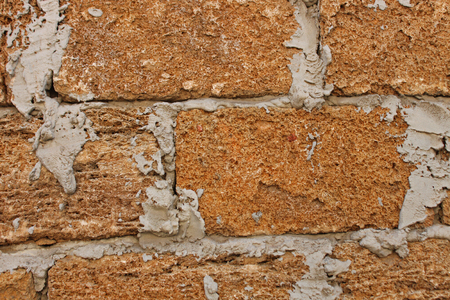 Old Vintage Red Brick Wall With Sprinkled Gray Cement Plaster Texture Background. Simple Grungy Shell Rock Brick Wall. Copy Space.の写真素材