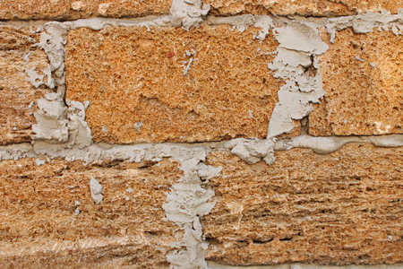 Old Vintage Red Brick Wall With Sprinkled Gray Cement Plaster Texture Background. Simple Grungy Shell Rock Brick Wall. Copy Space.の写真素材
