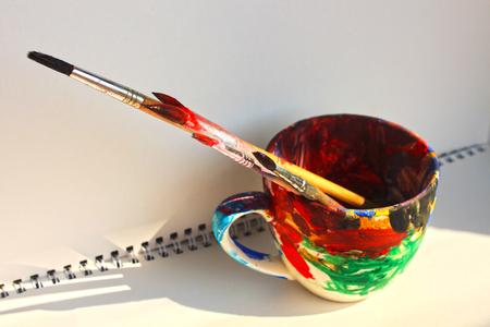 Art paint brushes in a cup with empty space for textの写真素材