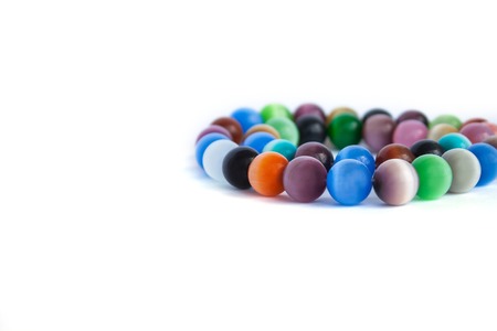 Cats eye quartz necklace and bracelet, selective focus on white background isolated. Colourful precious stones.の写真素材