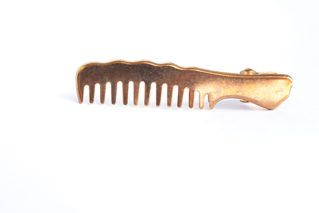 Modern metal barrette hair clip on a white background isolated, hairbrush.の写真素材