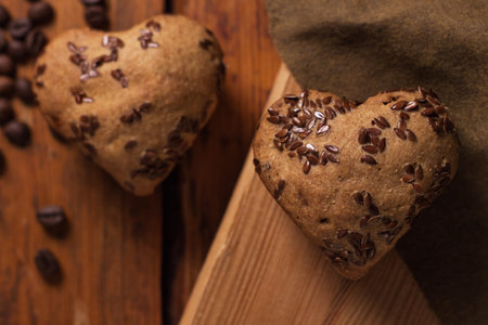 Heartshaped cakes on Valentines day on wooden background, top view, flatlay.Whole grain flour...