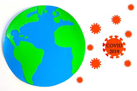 Earth planet fight with Coronavirus disease pandemic on white background isolated. Red paper molecule COVID-2019 infection. World Corona virus 2019 nCoV danger attack concept.Medical news site bannerの写真素材