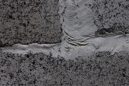 Dark grey limestone background used for kitchen worktop, table, window sill, fence. Black and white...