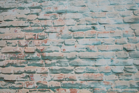 Old blue plaster on red brick wall texture. Retro putty building background copy space. Stylish...