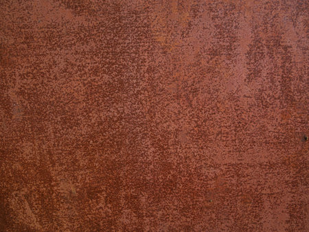 Rusty metal background. Red corroded texture. Damaged surface for text design. Old orange rust...