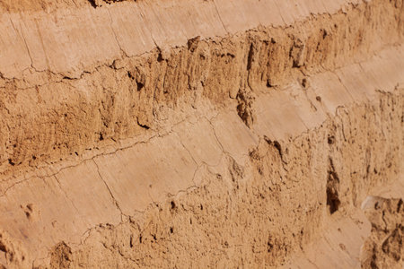 Background of great clay wall or brown ocher. Grunge rock texture Cracked ground texture in vintage...