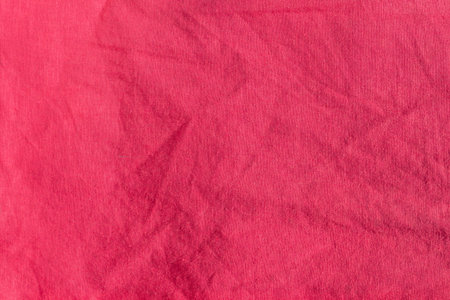 Pink linen fabric texture top view. Red coral background. Fashion color feminine clothes trends....