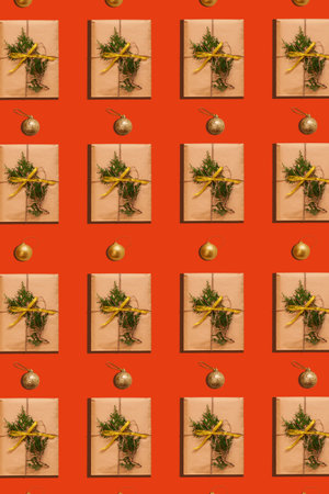 Trendy Christmas pattern made with paper gift boxes photo on pastel orange background. Minimal zero...