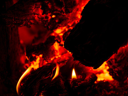 Burning firewood in rural oven.
