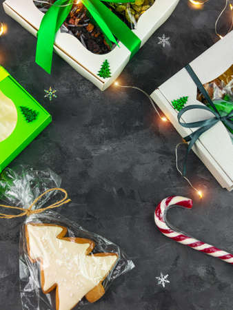 Christmas Gift boxes with set of different dried fruits nuts candied citrus individually wrapped flat lay vertical copy space. Winter holidays celebration. Healthy food diet. Organic eco mix top view.の写真素材