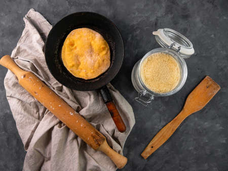 Homemade corn flatbread meal frying pan linen cloth. Handmade mexican tortilla for wrapping. Traditional latin cornmeal dough bread top view Authentic cuisine Taco Quesadilla cooking recipe ingredientの写真素材