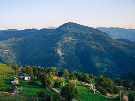 Village in Transcarpathia region scenic Carpathian mountains view Ukraine, Europe. Autumn countryside landscape fall spruce pine trees. Eco Local tourism hiking Recreational activities Vacationの写真素材