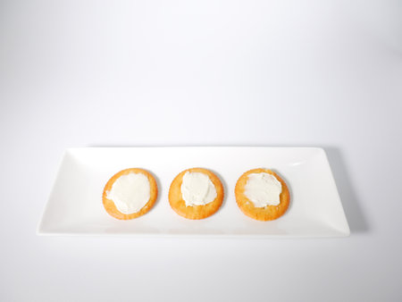 Round crackers with cream cheeseの写真素材