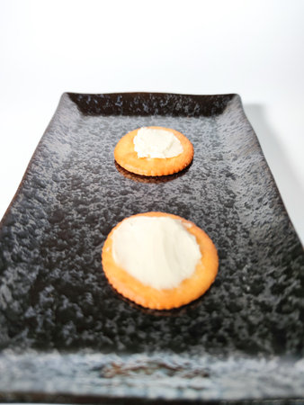 Round crackers with cream cheeseの写真素材