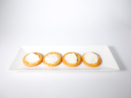 Round crackers with cream cheeseの写真素材