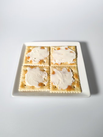 Square cracker with cream cheeseの写真素材