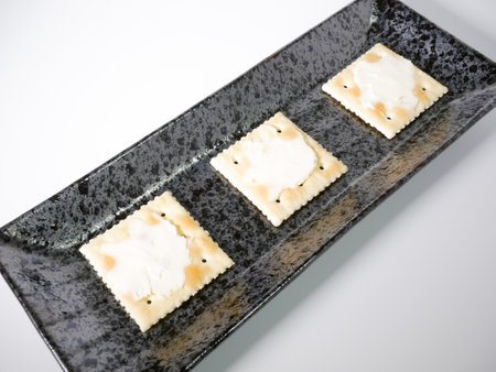 Square cracker with cream cheeseの写真素材