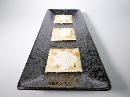Square cracker with cream cheeseの写真素材