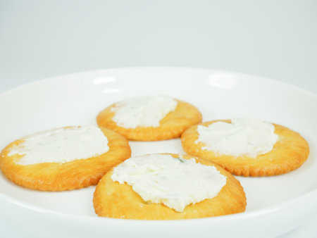 Round crackers with herb cheeseの写真素材